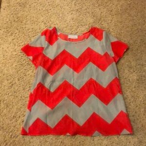 Chevron grey and coral open back top.